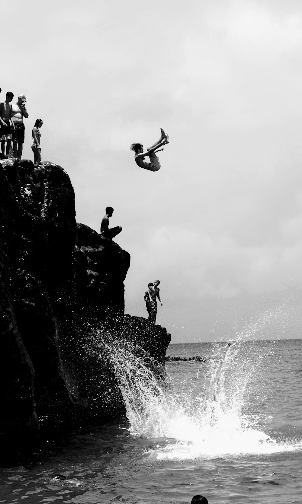 a person jumping off a cliff
