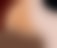 A blurred and abstract representation featuring gradients of beige and brown, transitioning into darker areas.