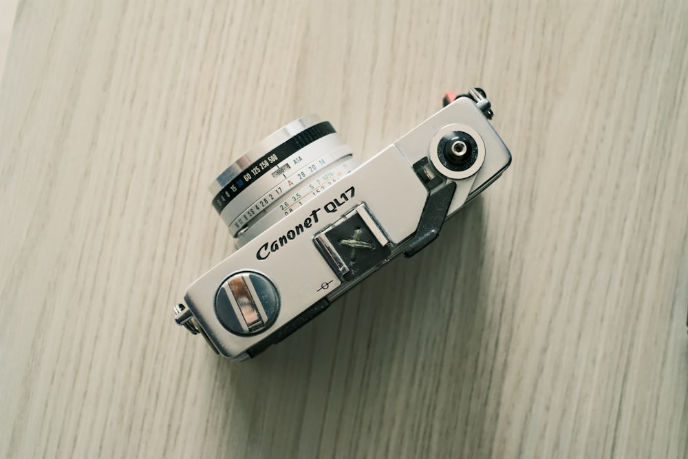 a small silver and black camera