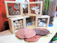 An assortment of finished blocora block creations displayed on a shelf.