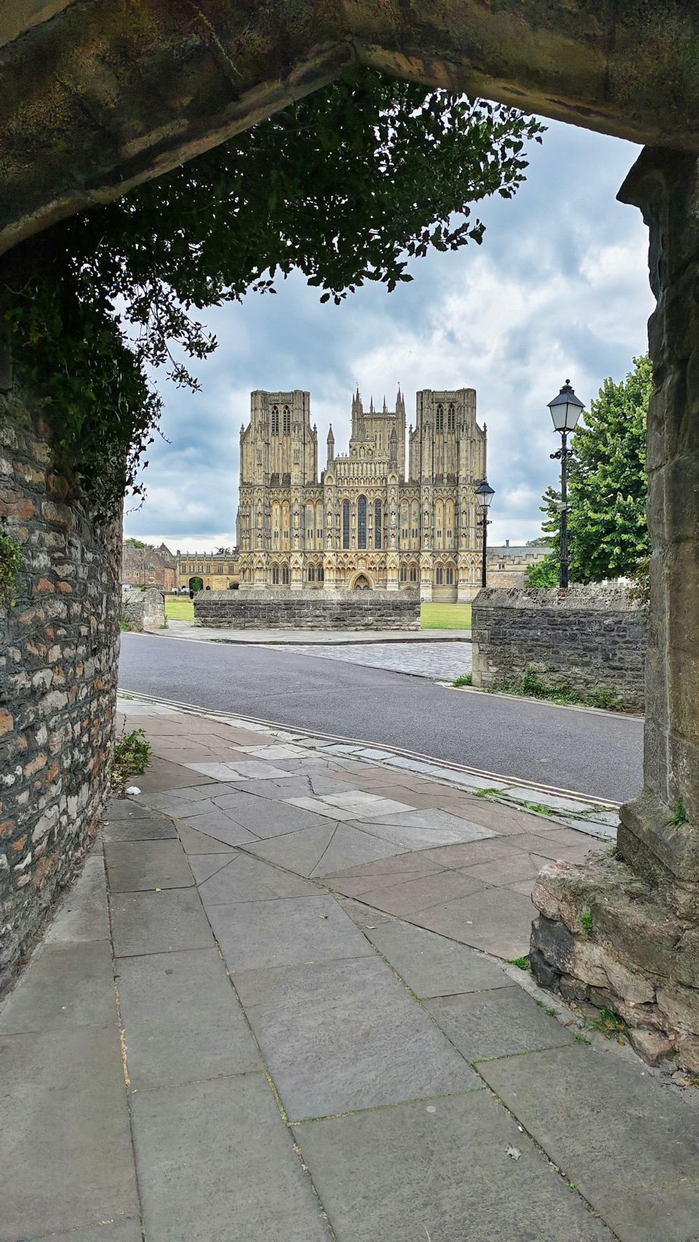 a stone walkway leading to a castle