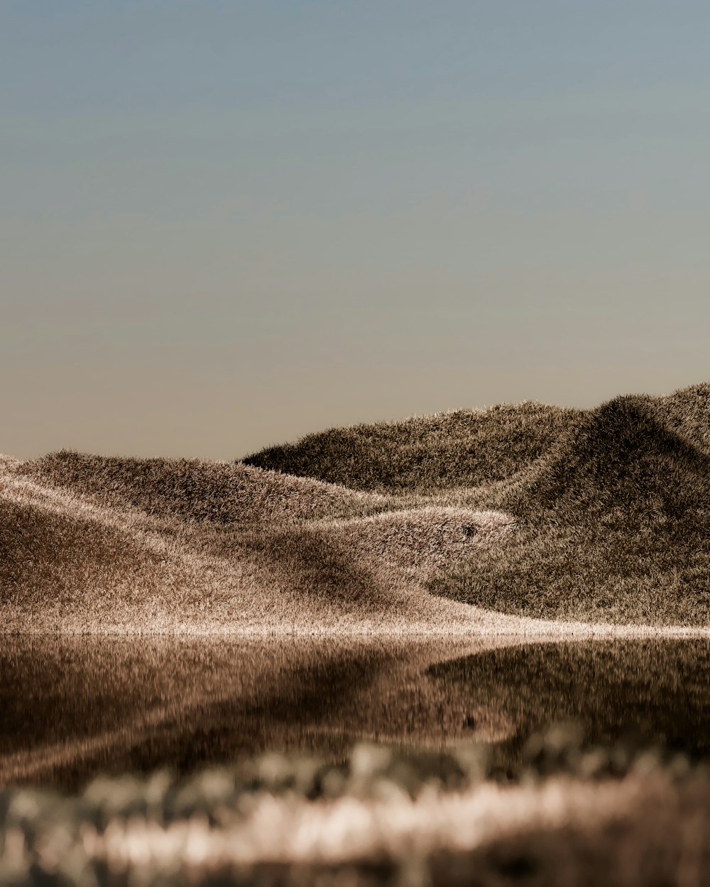 a landscape with hills and a road