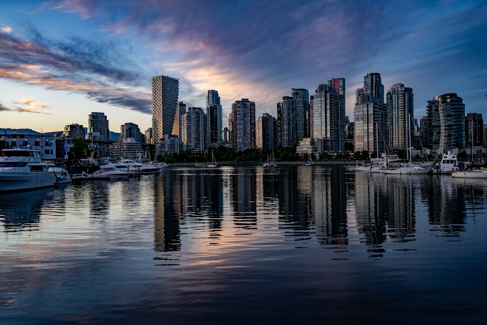 a city skyline with boats