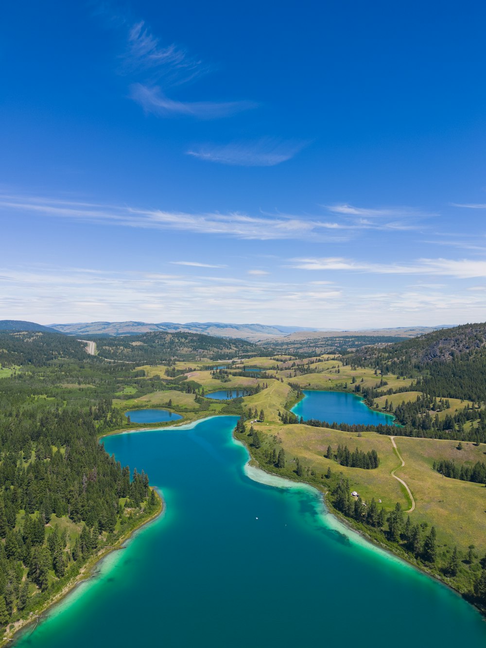 a river with trees and hills around it