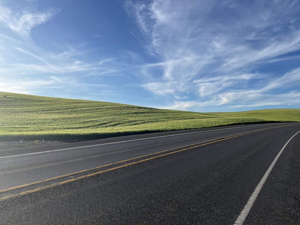 a road with grass on the side