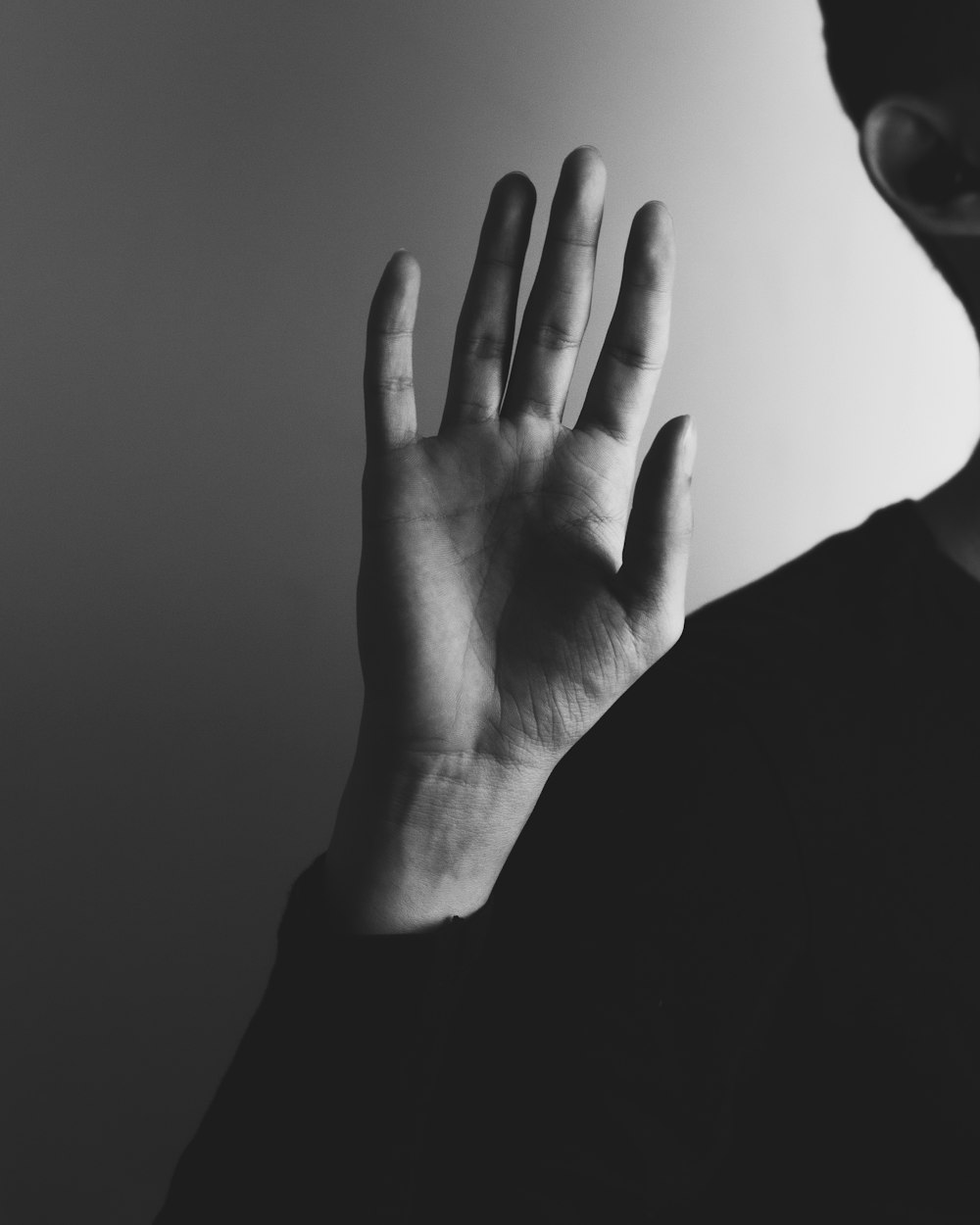 a hand with a black background