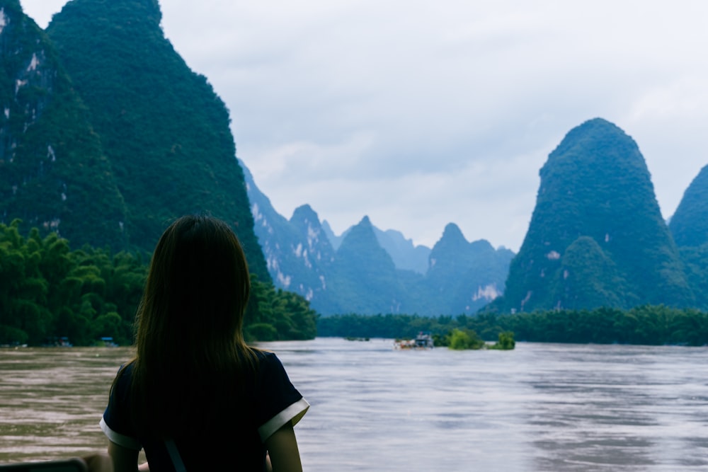 a person looking out over Li River