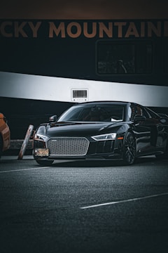 Outdoor billboard featuring a sleek car with bold marketing graphics