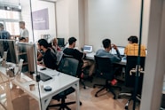 a group of people sitting at computers