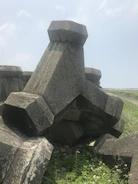Stacked Ronblock concrete blocks ready for construction on a sunny site.
