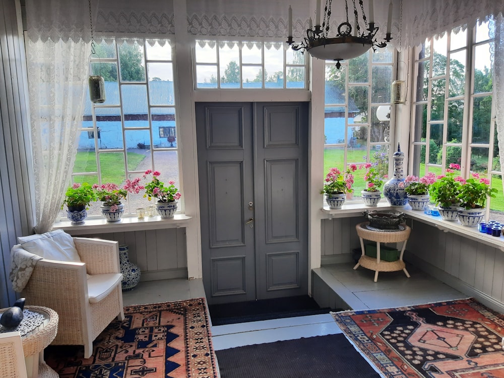 a room with a door and chairs