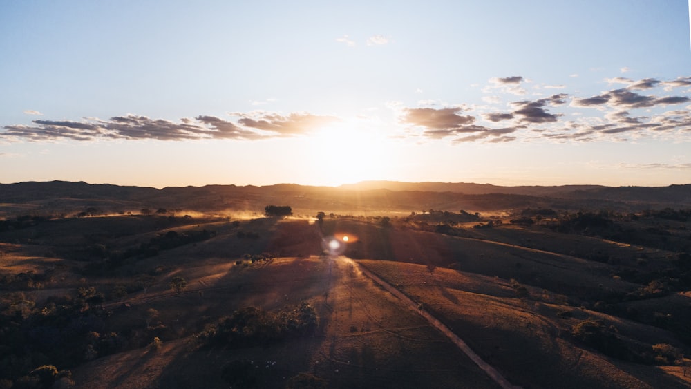 a road with a sunset in the background