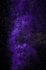 Subtle particle effect overlaid on a deep purple background symbolizing clarity.