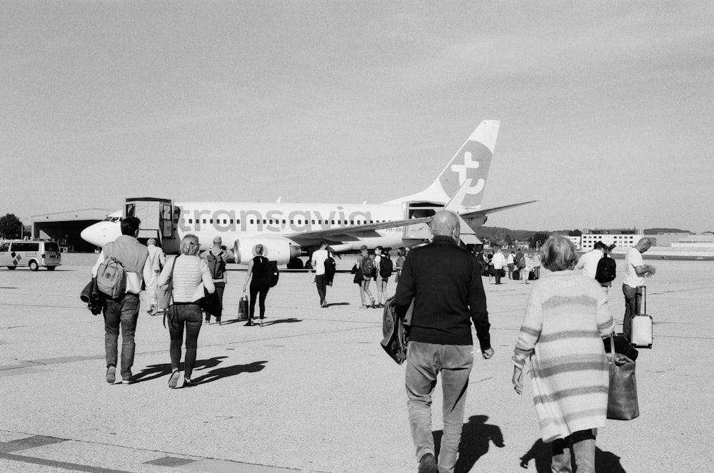 people boarding a plane