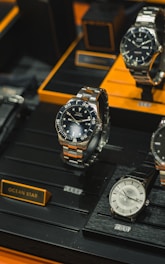 a group of watches on a display