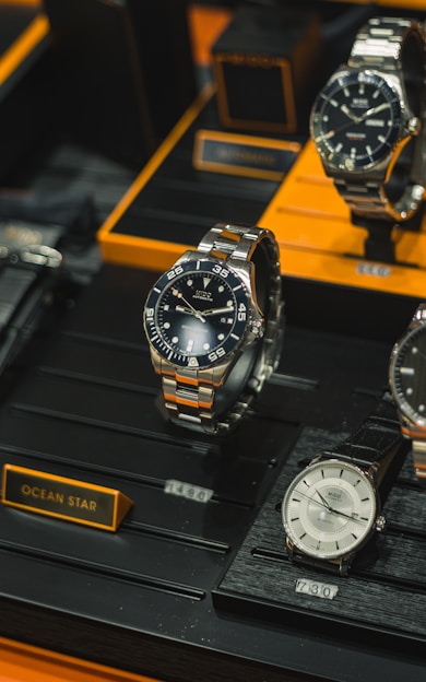 a group of watches on a display