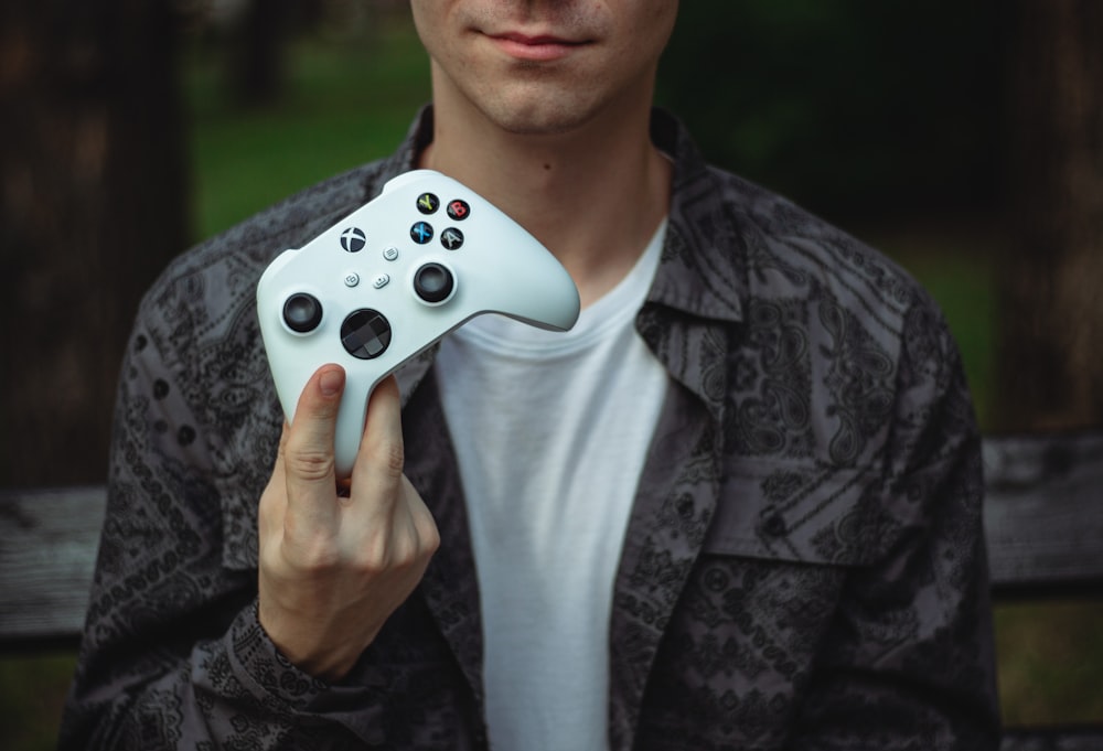 a person holding a video game controller