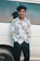 a man standing next to a car