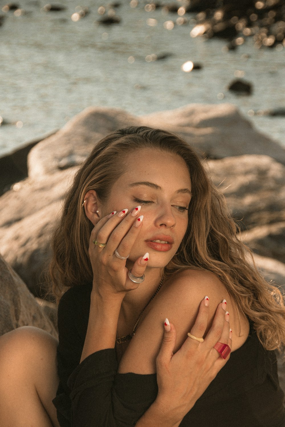 a woman with her hands on her face