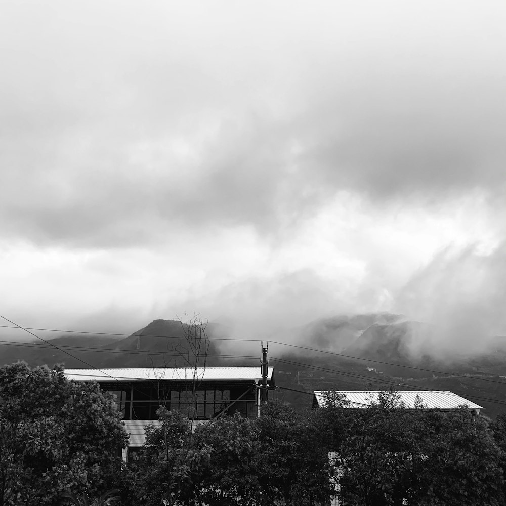 a building with a cloudy sky above