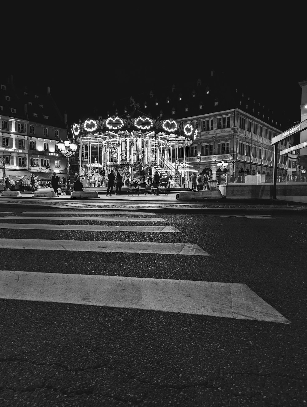 a street with a building with lights