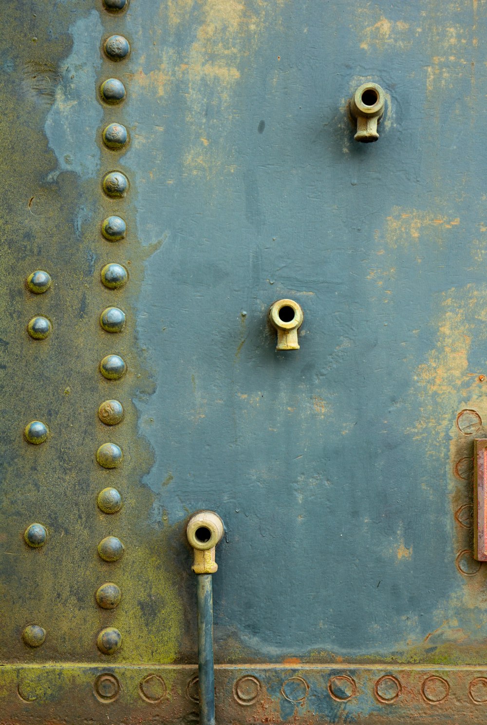 a metal door with rust on it