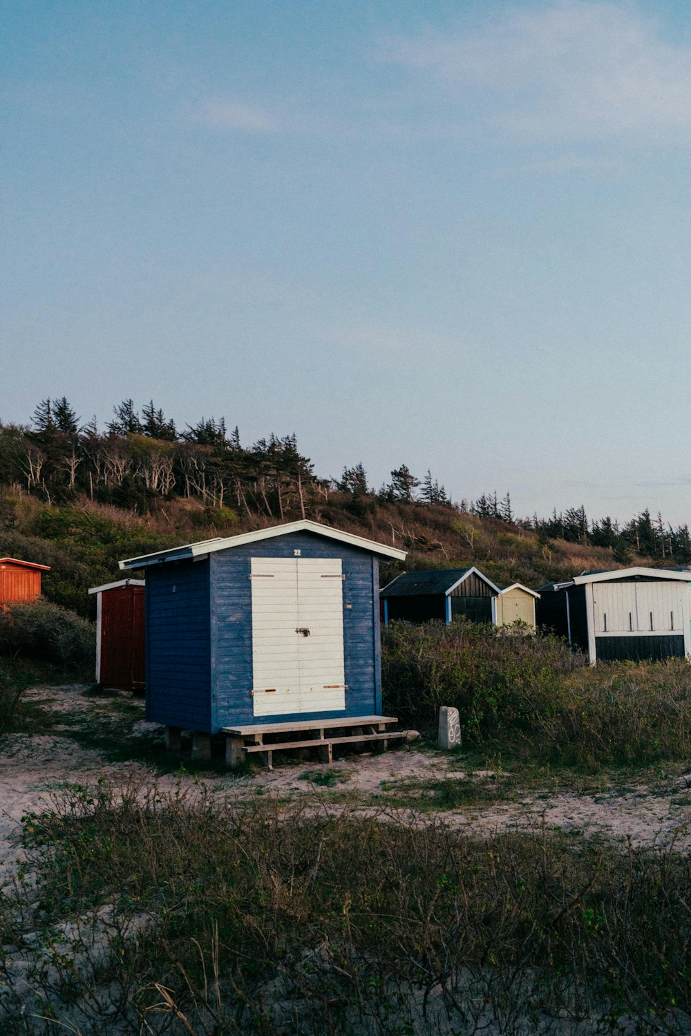 a group of sheds on a hill