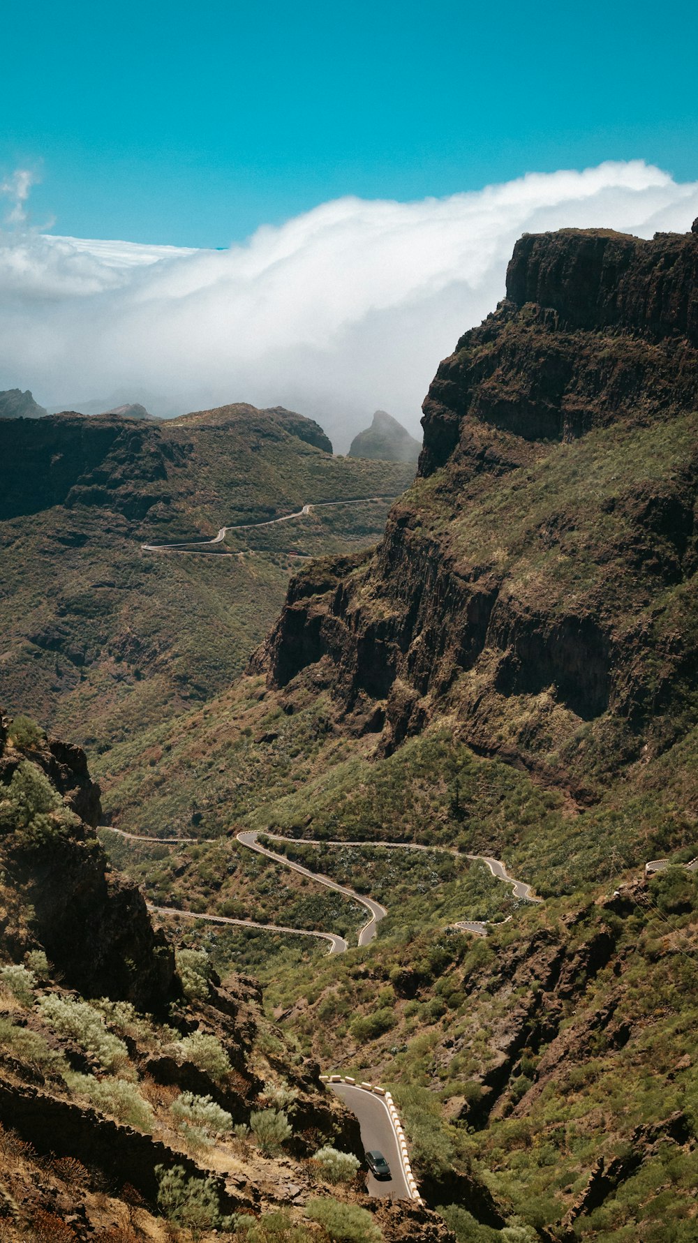 a winding road through a valley