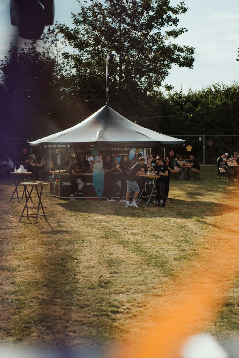 a group of people playing instruments under a tent