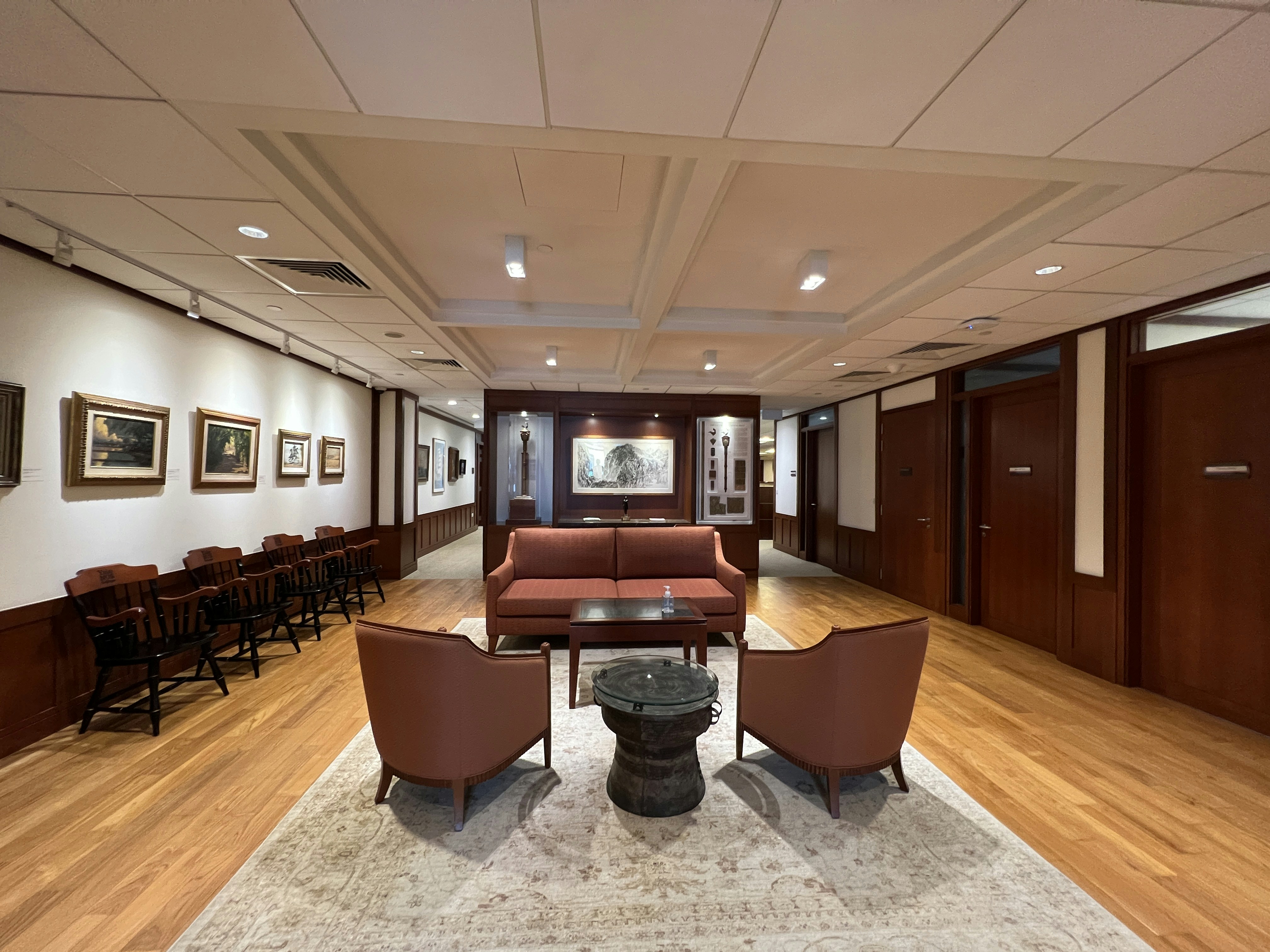 a room with a table chairs and a tv