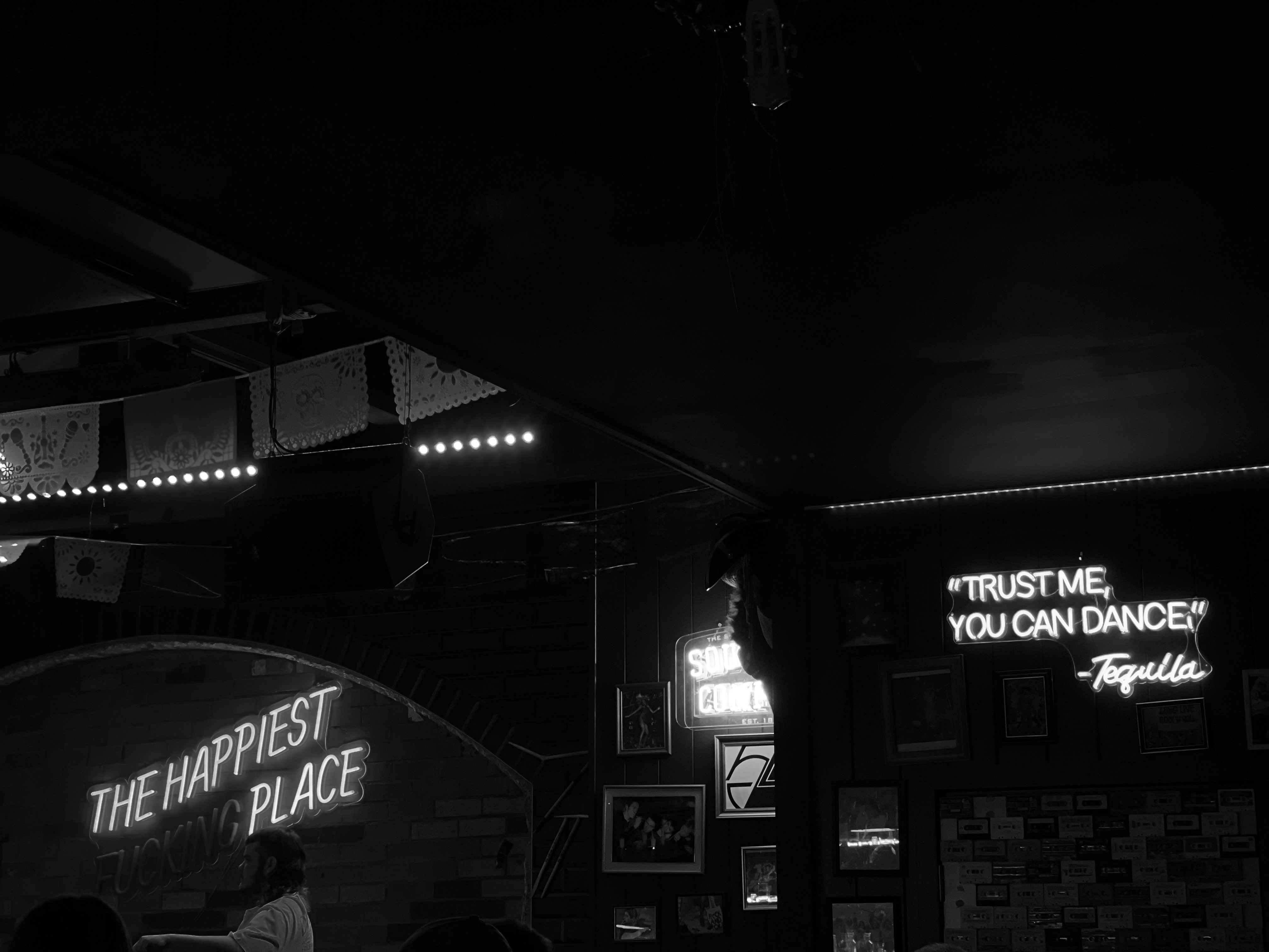 Event venue with professional banners and signage in dramatic dark atmospheric lighting