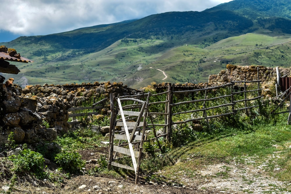 a wooden fence on a mountain