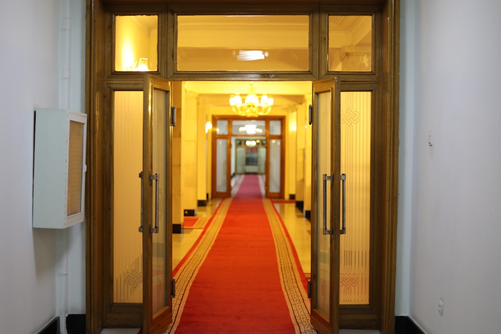 a hallway with orange carpet