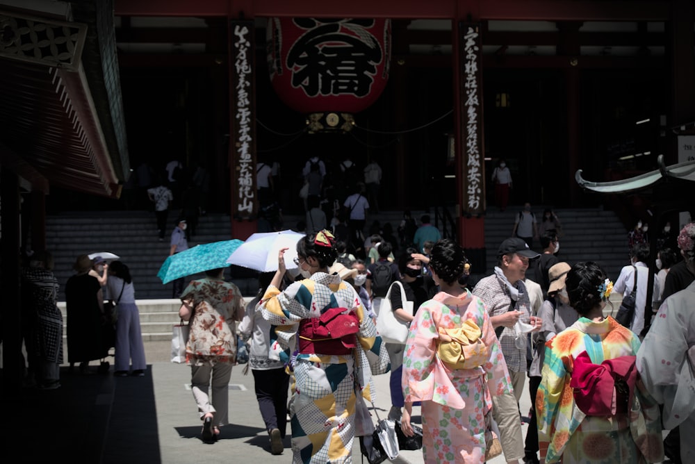 a group of people walking down a street