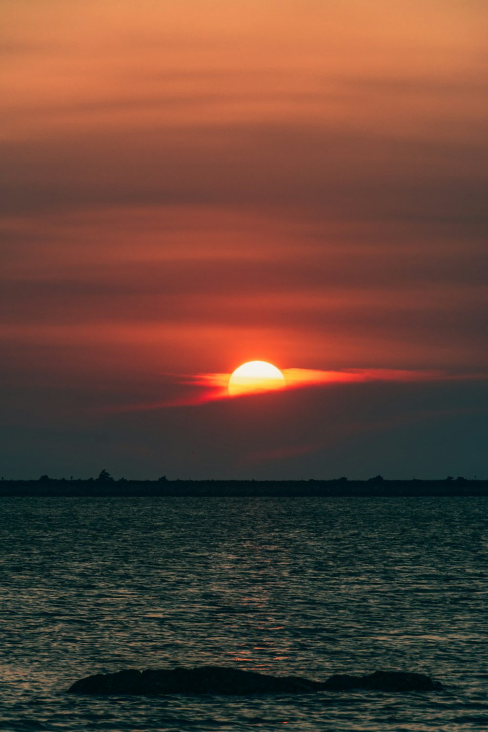 a sunset over a body of water