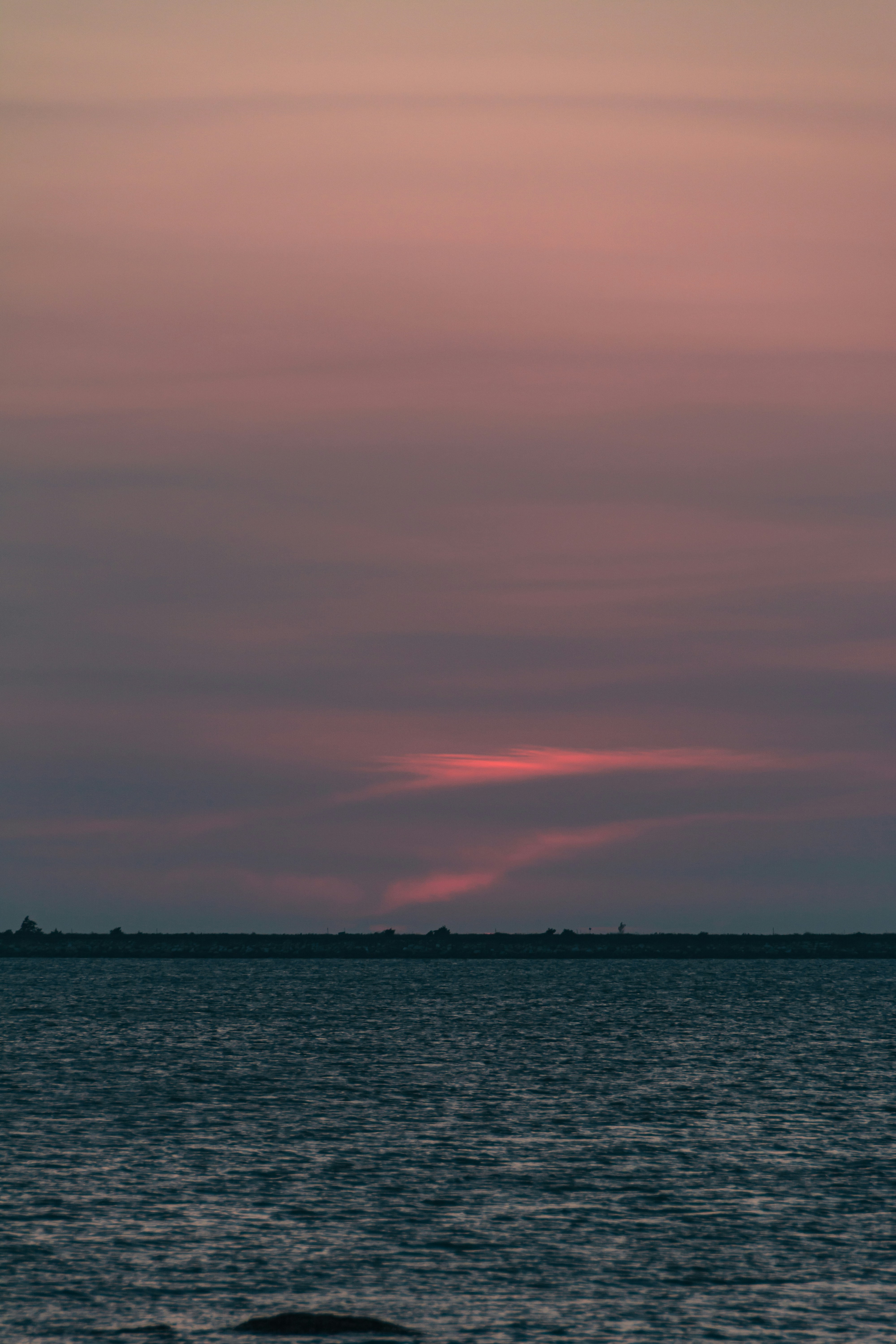 a body of water with a land in the distance
