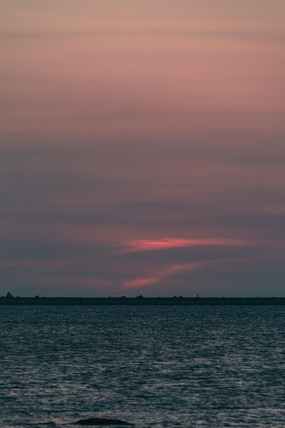 a body of water with a land in the distance