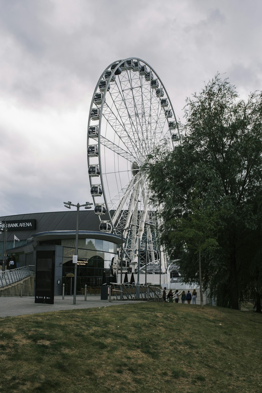 a ferris wheel next to a building