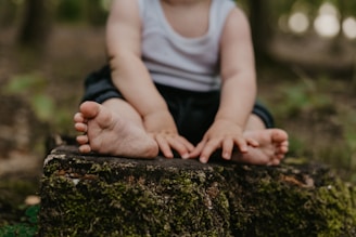 a person sitting on a rock