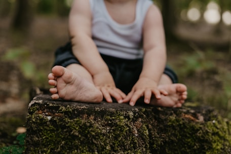 a person sitting on a rock