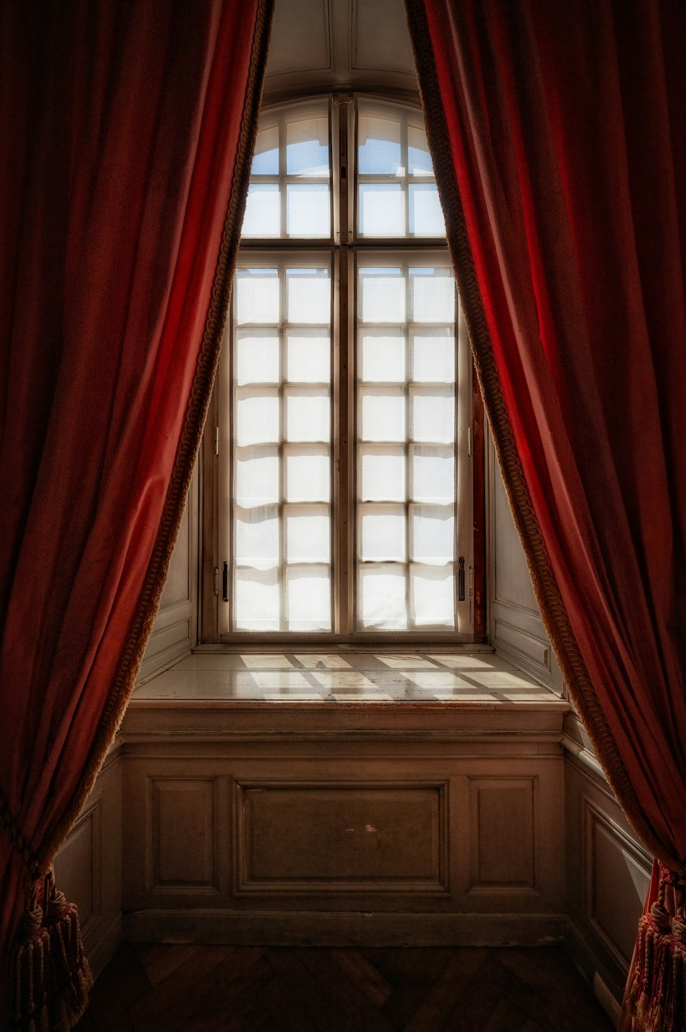 a window with red curtains