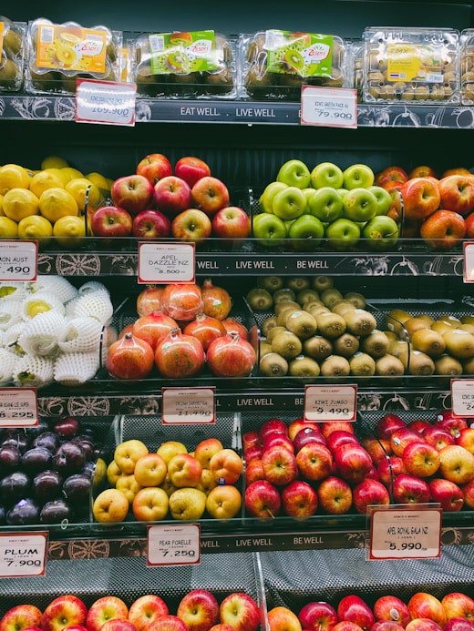 a bunch of apples in a display