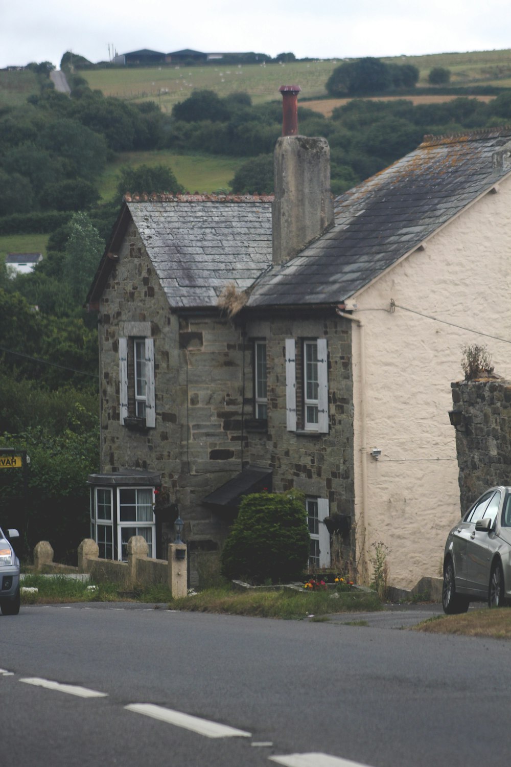 a stone building with a chimney