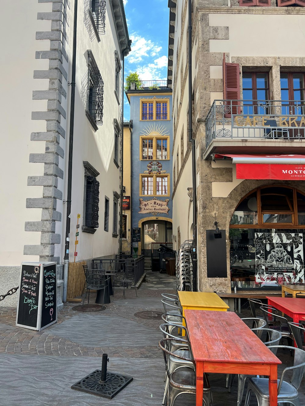 a table and chairs outside of a building