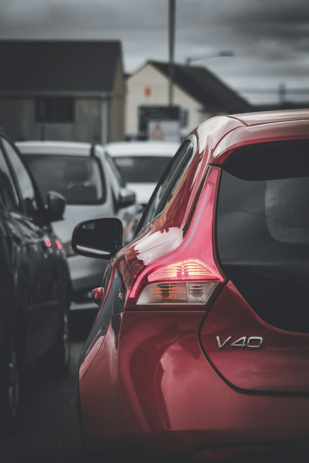 a red car in a parking lot