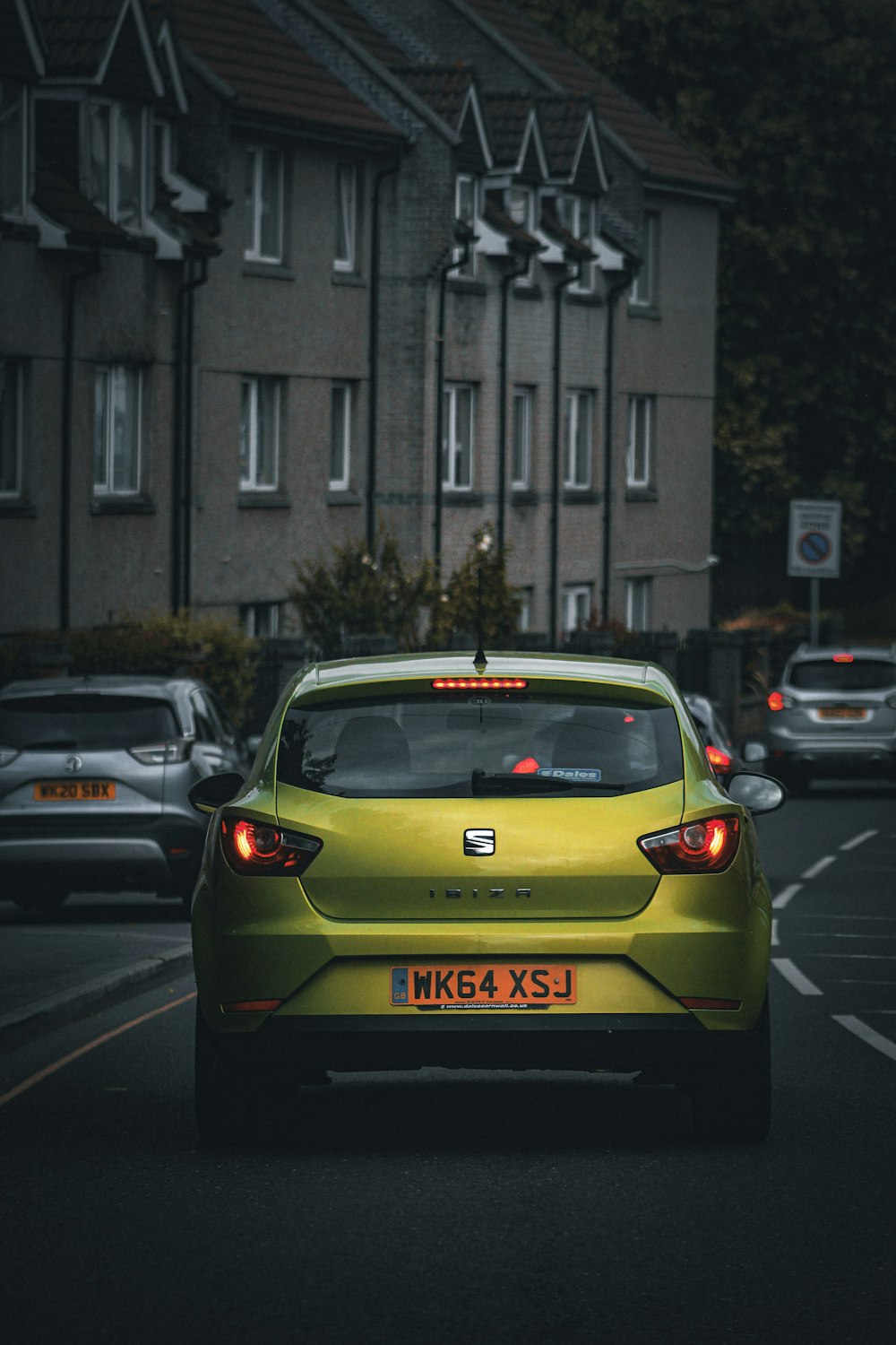 a yellow car on a road