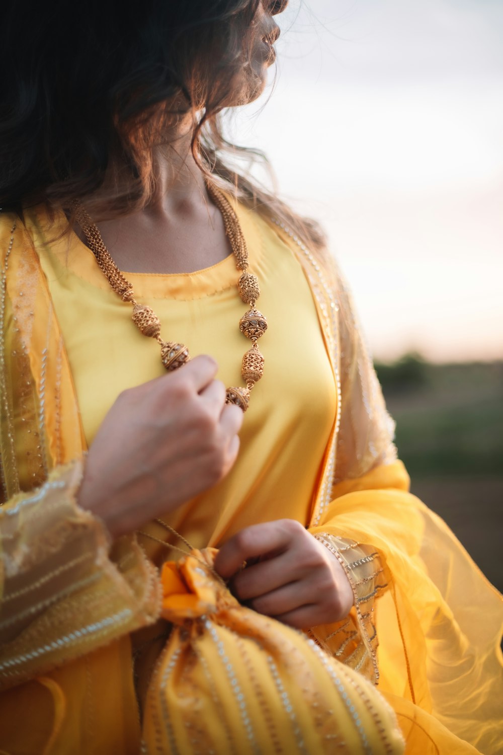 a woman wearing a yellow dress