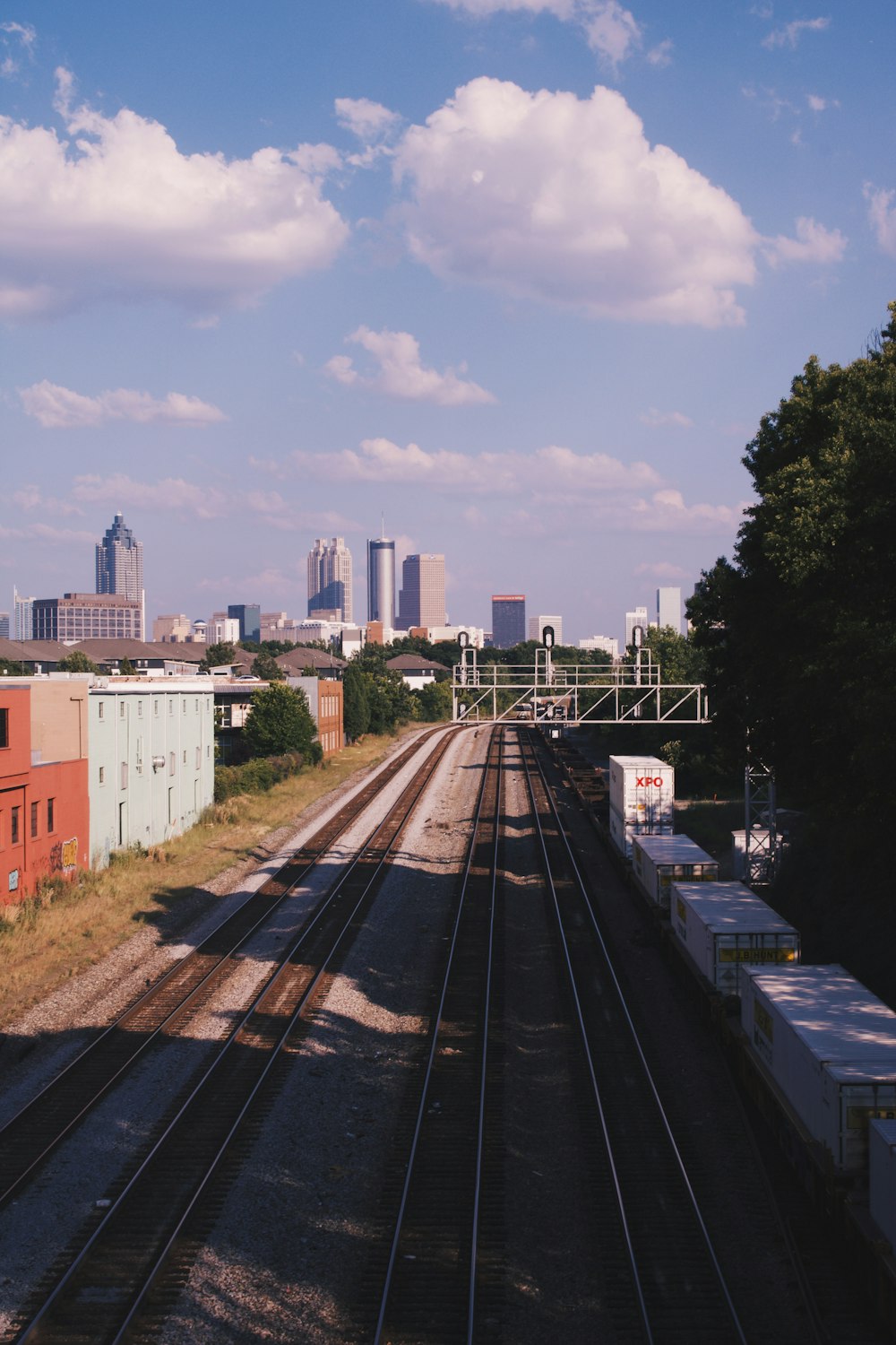 train tracks with buildings in the background