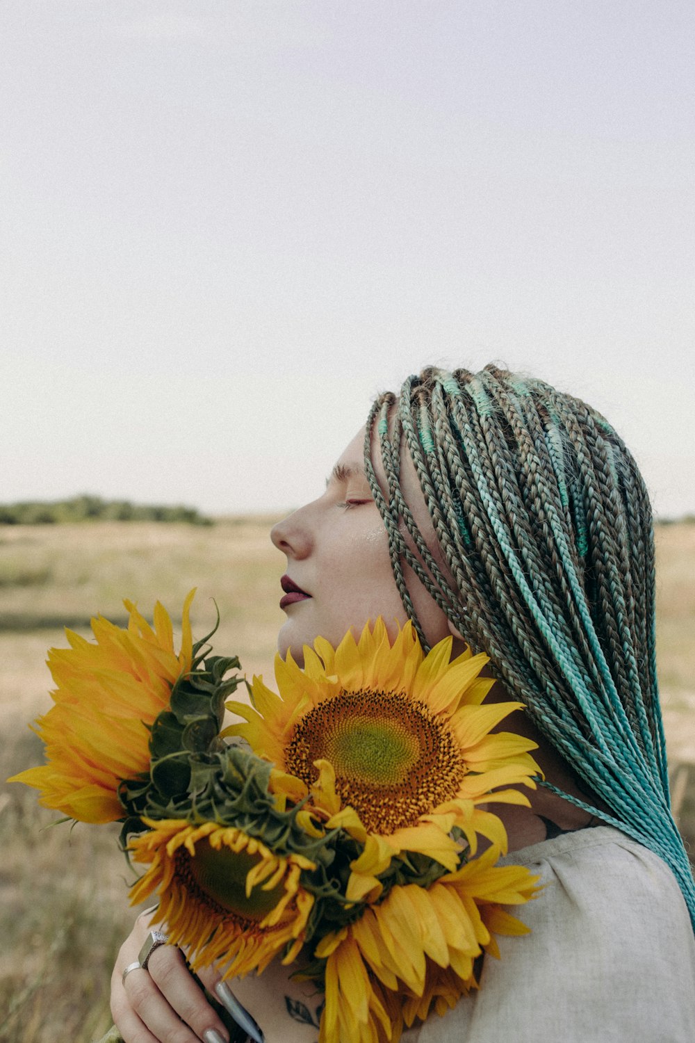 a person holding a sunflower