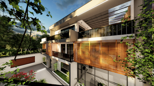 A modern, architectural house with large windows and wooden paneling on the upper floor. The building is surrounded by greenery including trees and shrubs in a well-maintained garden area. The sky is partly cloudy, and there is a warm light cast over the structure, suggesting a serene and comfortable setting.